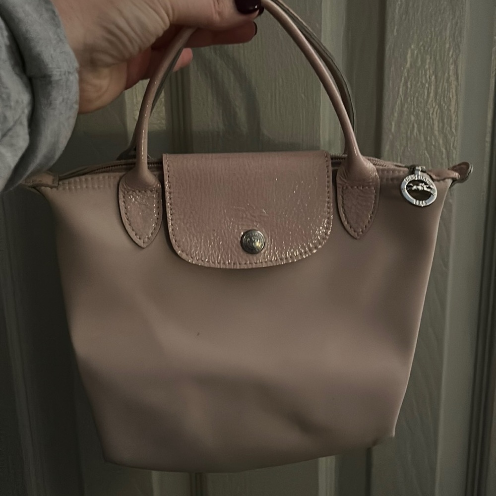 Longchamp Mini “Le Pliage” handbag in light pink